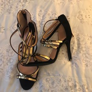 Brand new gold and black straps heels